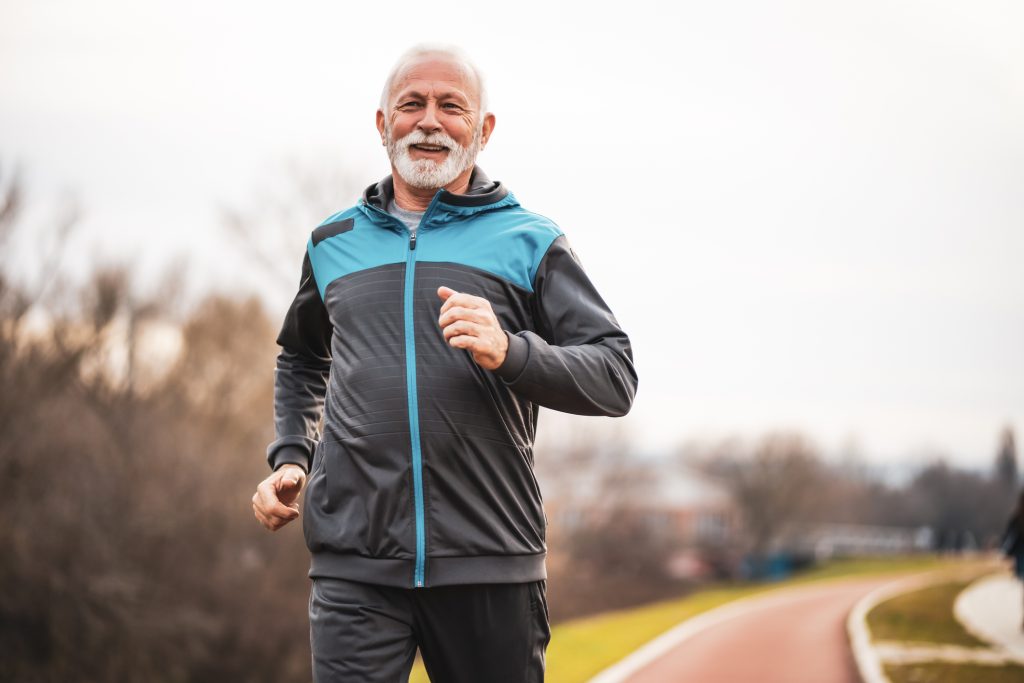 Active man running on a track or trail